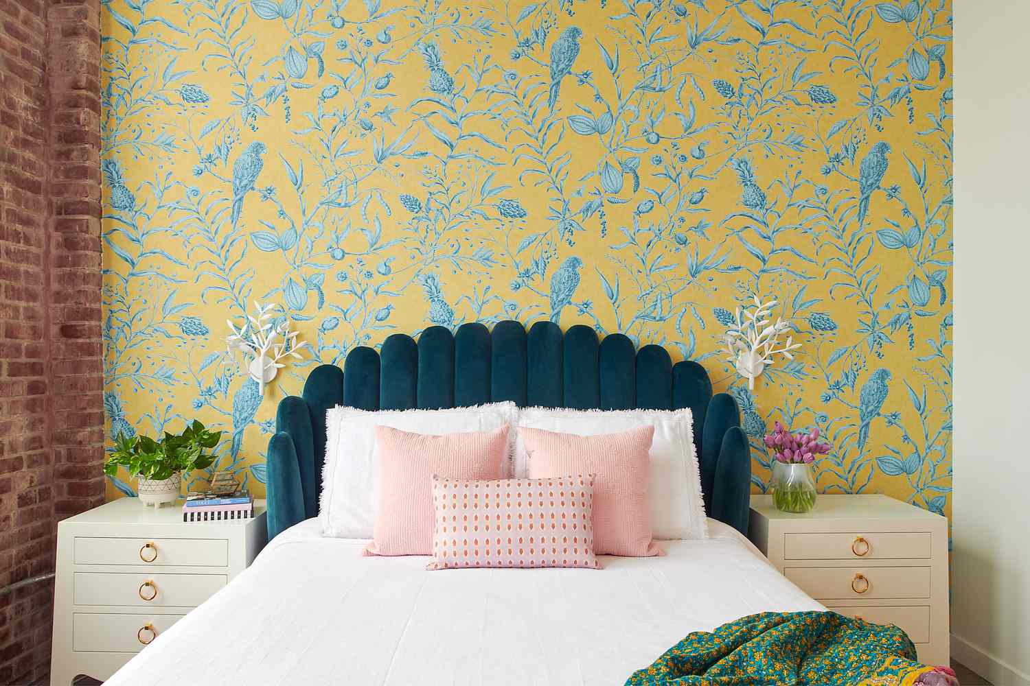 Patterned wallpaper feature wall in an elegant bedroom